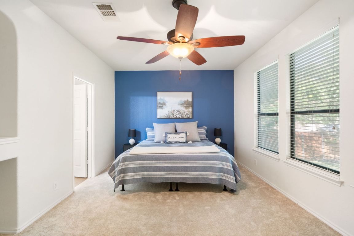 366 Matthews Lane Kyle, TX 78640 - Photo 15 of 25 a bedroom with a bed and window