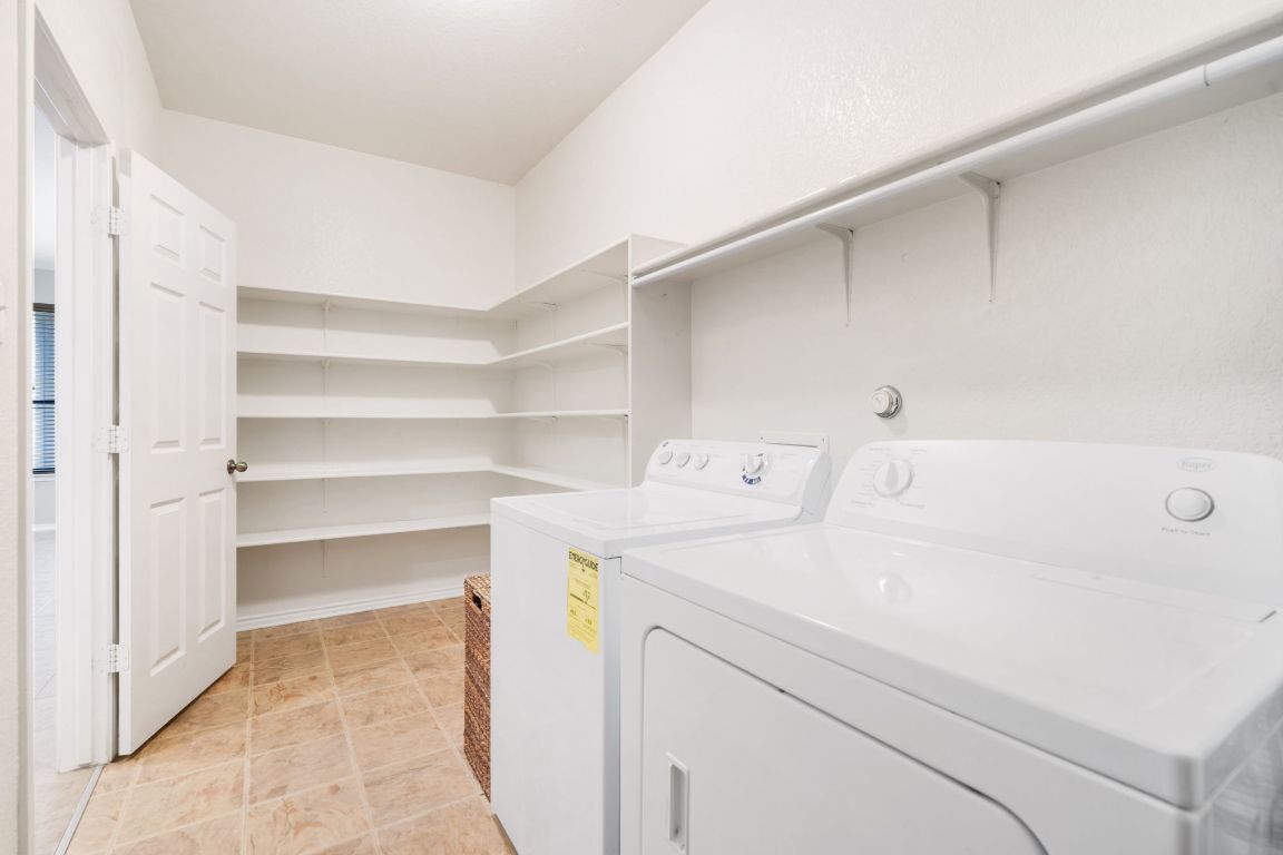 366 Matthews Lane Kyle, TX 78640 - Photo 19 of 25 a utility room with dryer and washer