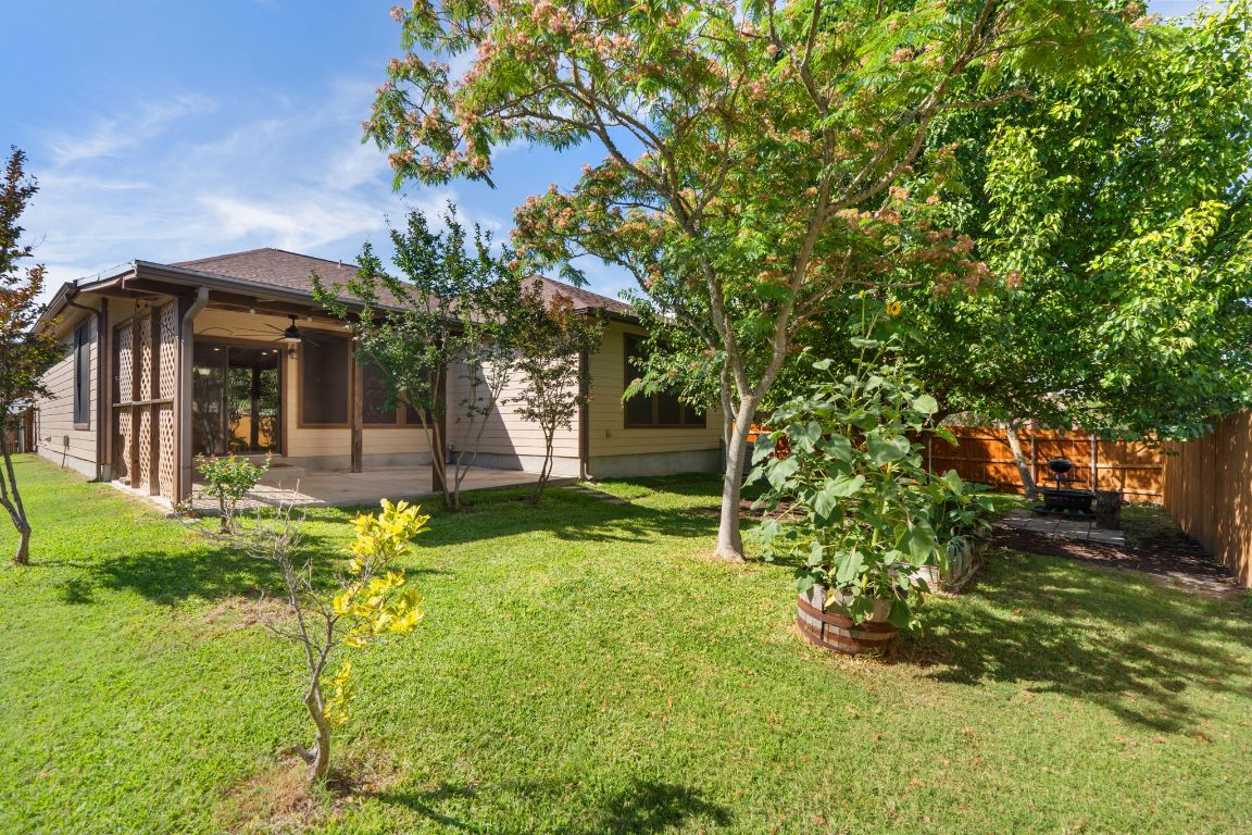 366 Matthews Lane Kyle, TX 78640 - Photo 2 of 25 a front view of a house with garden