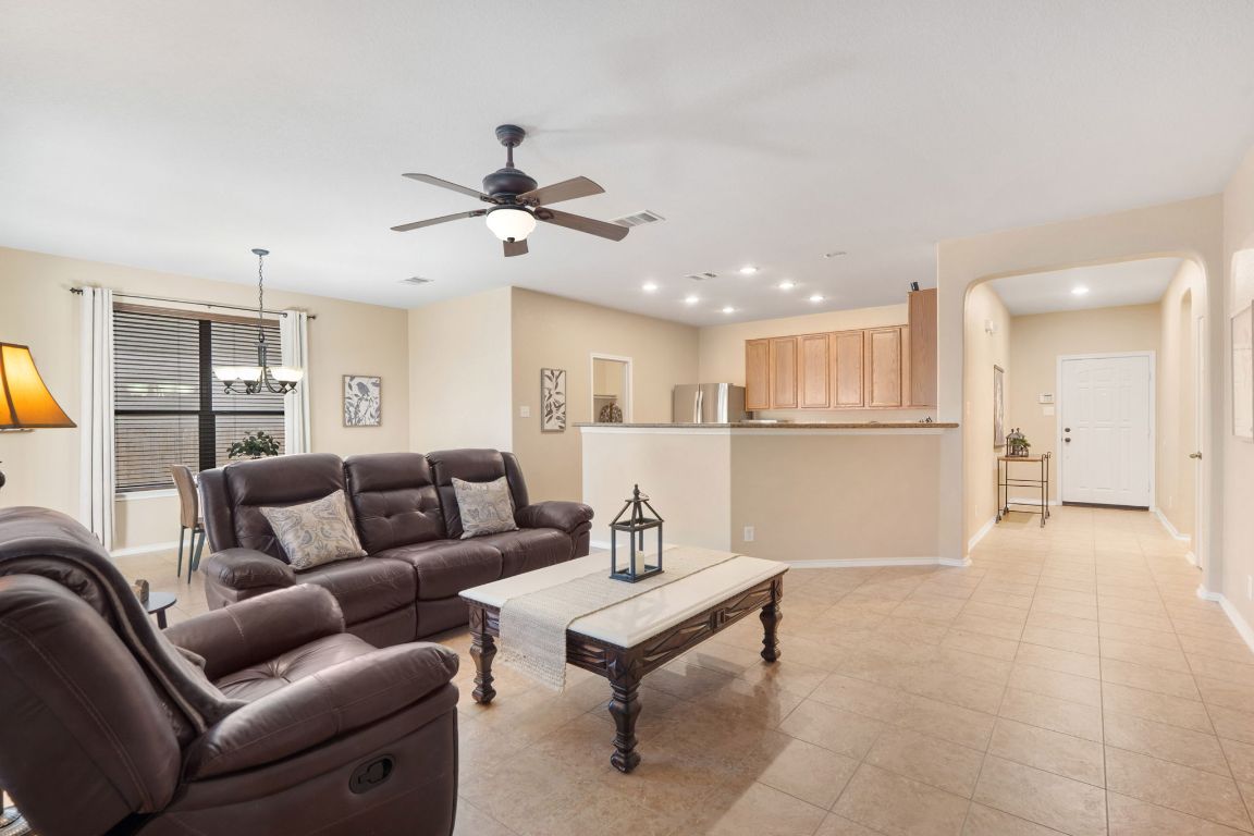 366 Matthews Lane Kyle, TX 78640 - Photo 7 of 25 a living room with furniture and kitchen view