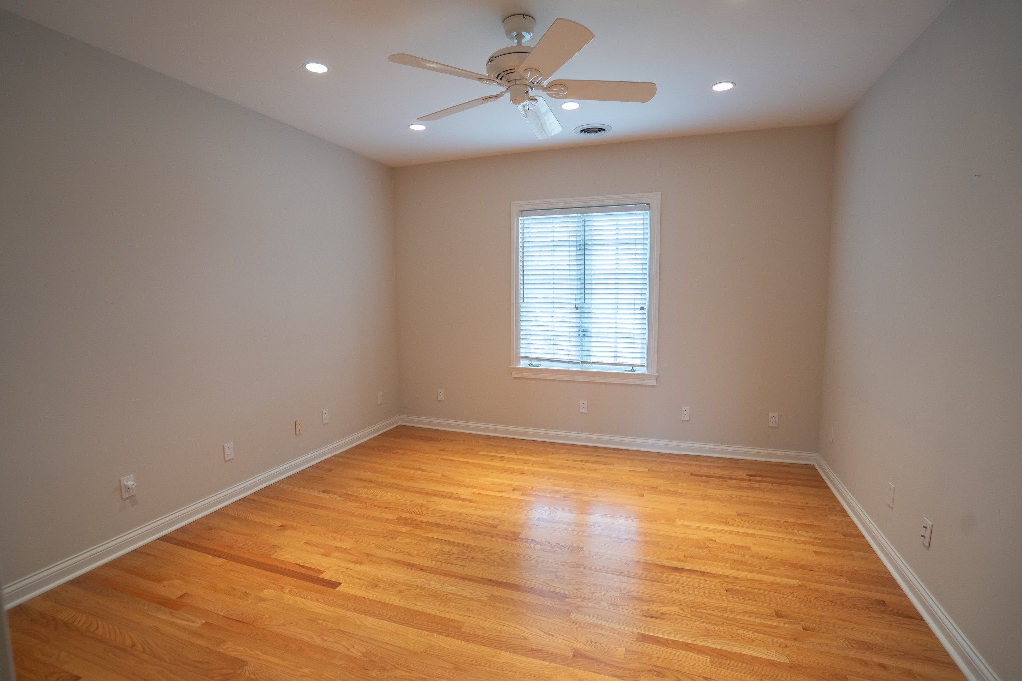 156 Eagle Pointe Springfield, TN 37172 - Photo 22 of 36 an empty room with wooden floor ceiling fan and windows