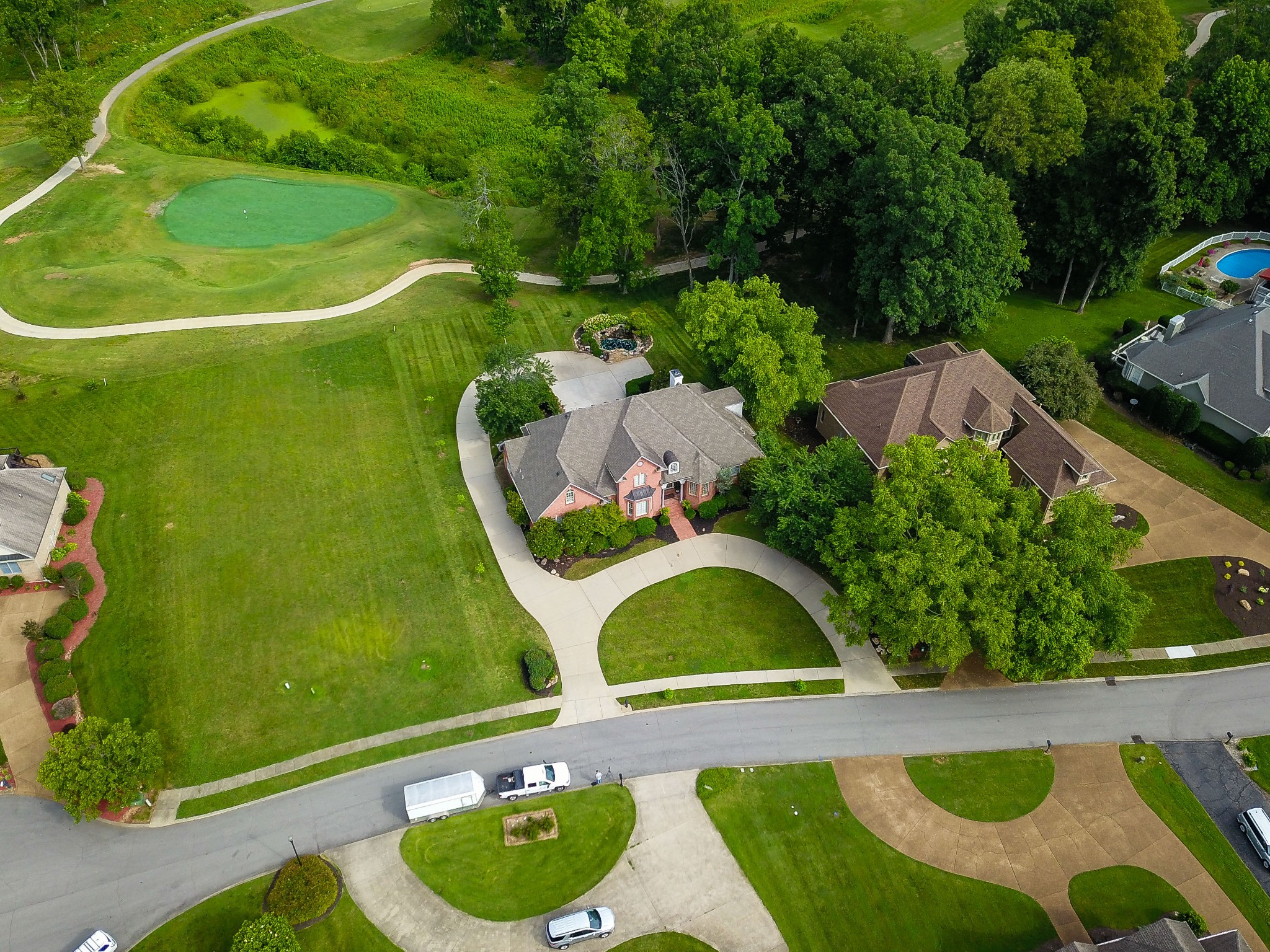156 Eagle Pointe Springfield, TN 37172 - Photo 35 of 36 a view of a swimming pool with a yard and plants