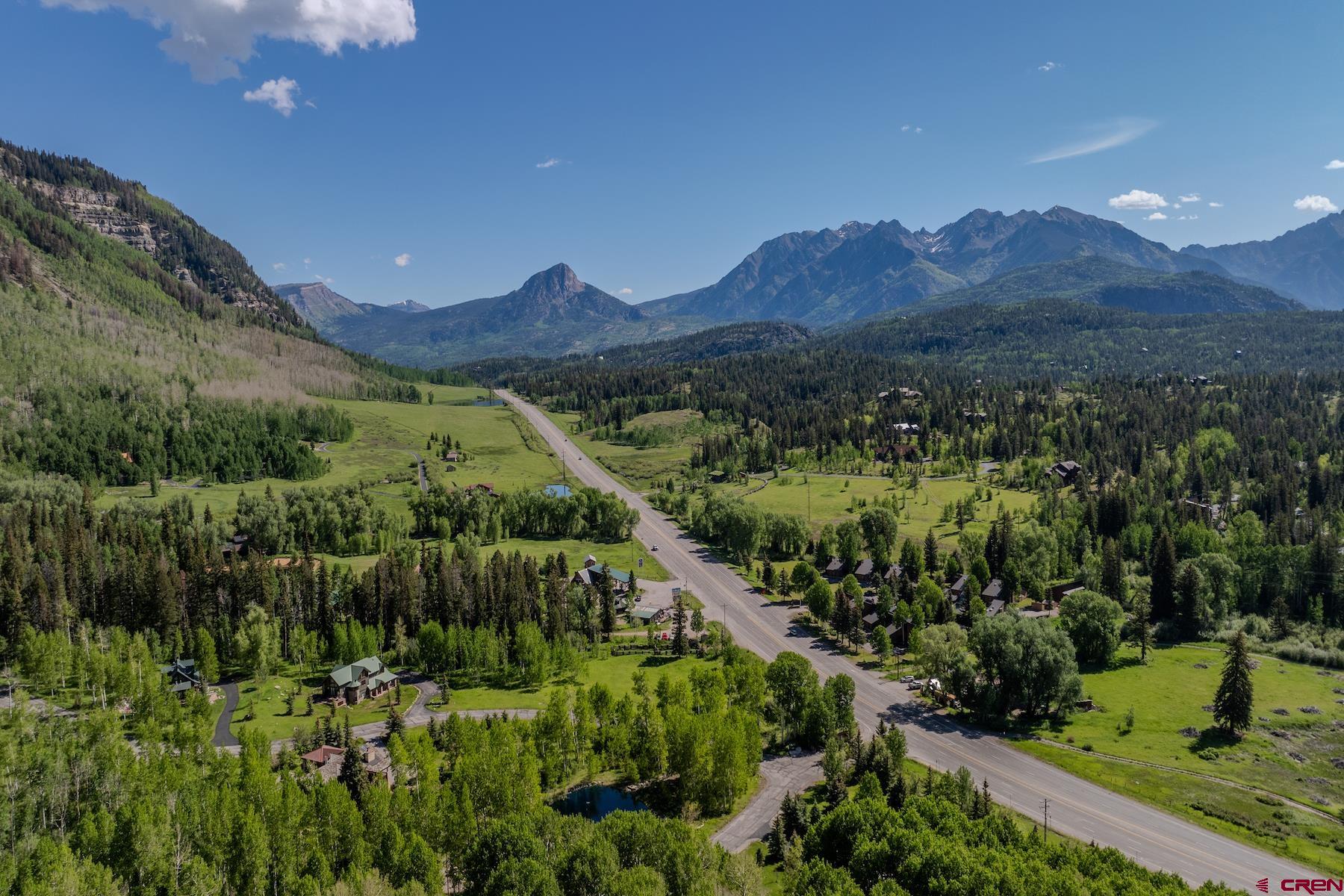 75 Falcon Ridge Road Durango, CO 81301 - Photo 14 of 27 a view of a lush green hillside and a building