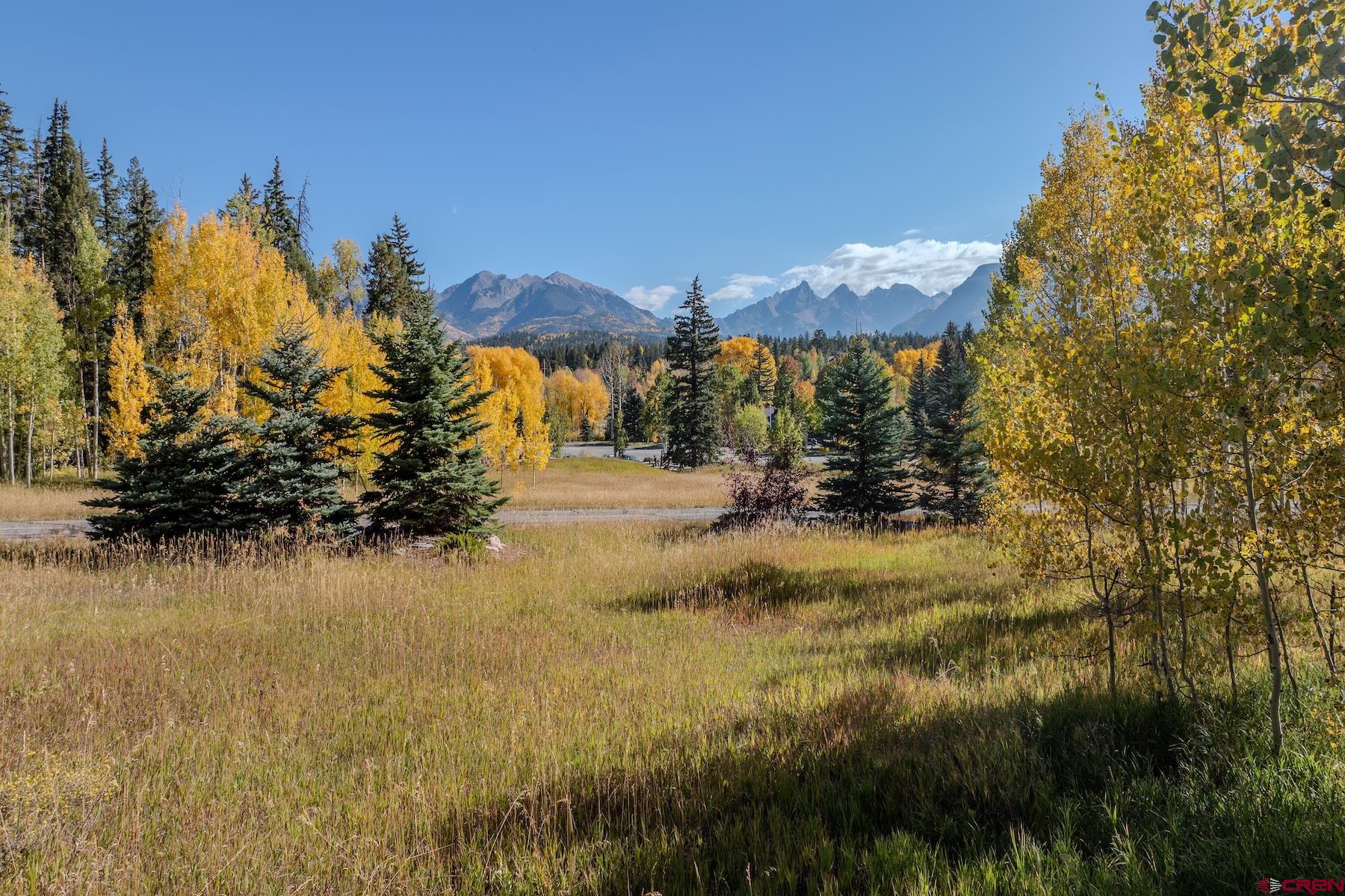 75 Falcon Ridge Road Durango, CO 81301 - Photo 2 of 27 a view of a lake with a building in the background