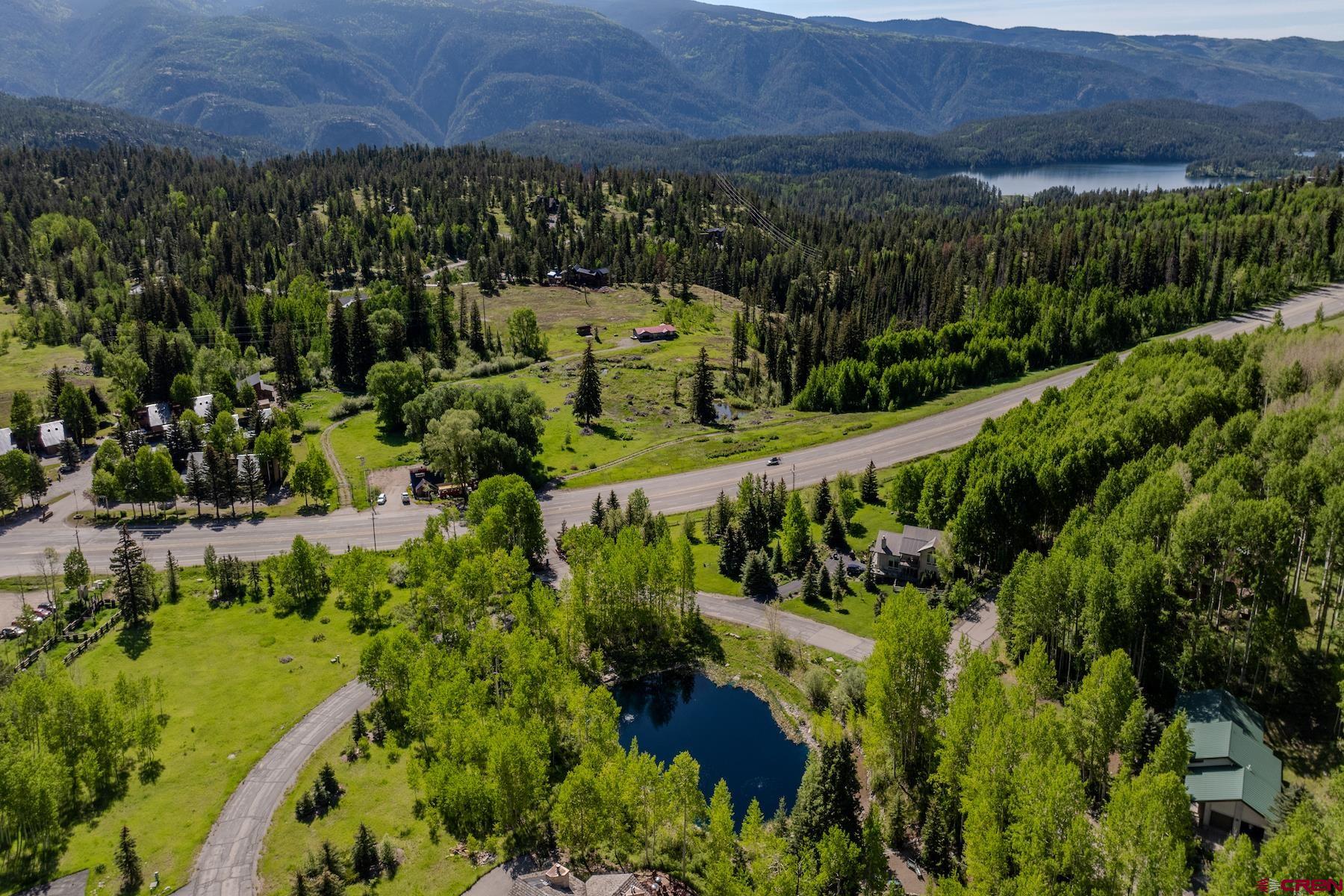 75 Falcon Ridge Road Durango, CO 81301 - Photo 25 of 27 a view of a garden with a building in the background