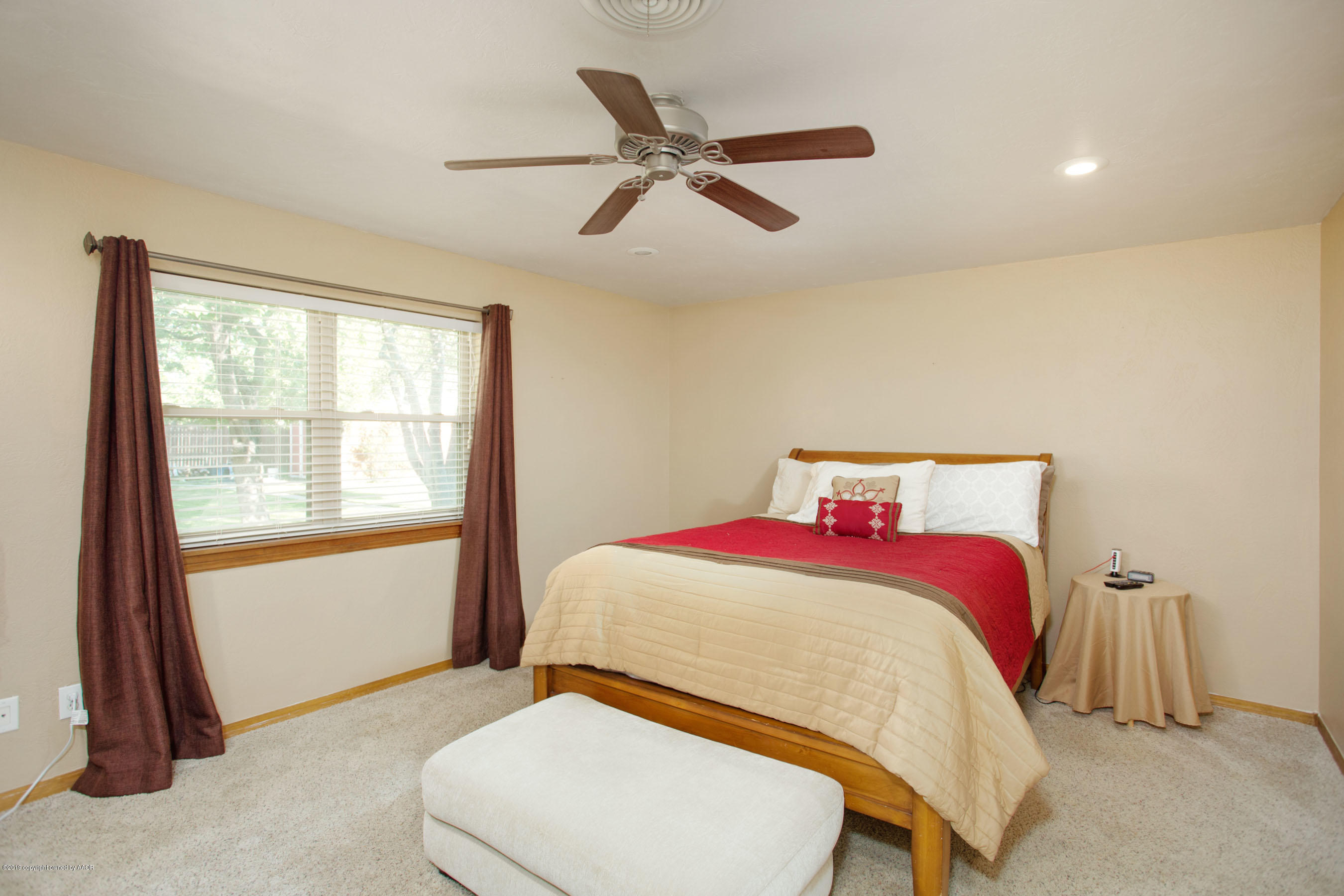 8110 Santa Fe Trail Amarillo, TX 79110 - Photo 14 of 25 a bedroom with a bed and a window