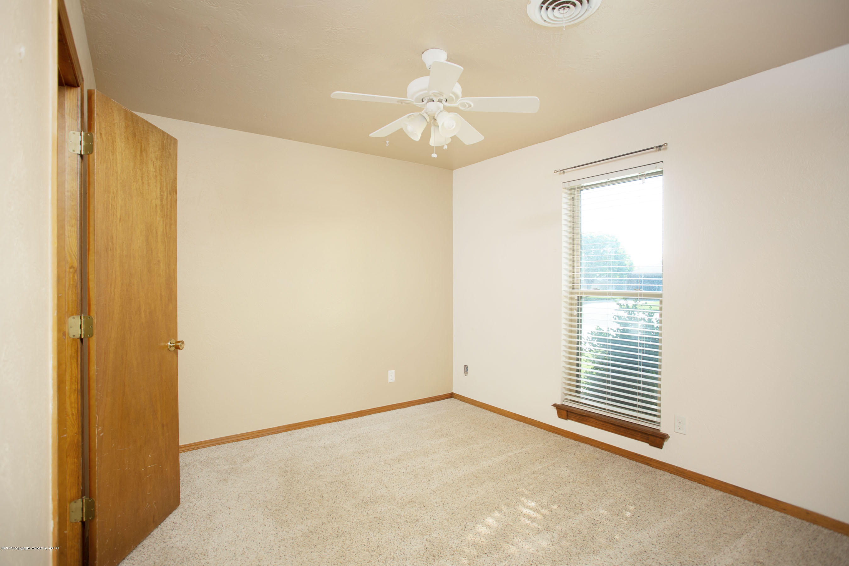 8110 Santa Fe Trail Amarillo, TX 79110 - Photo 17 of 25 a view of an empty room with a window