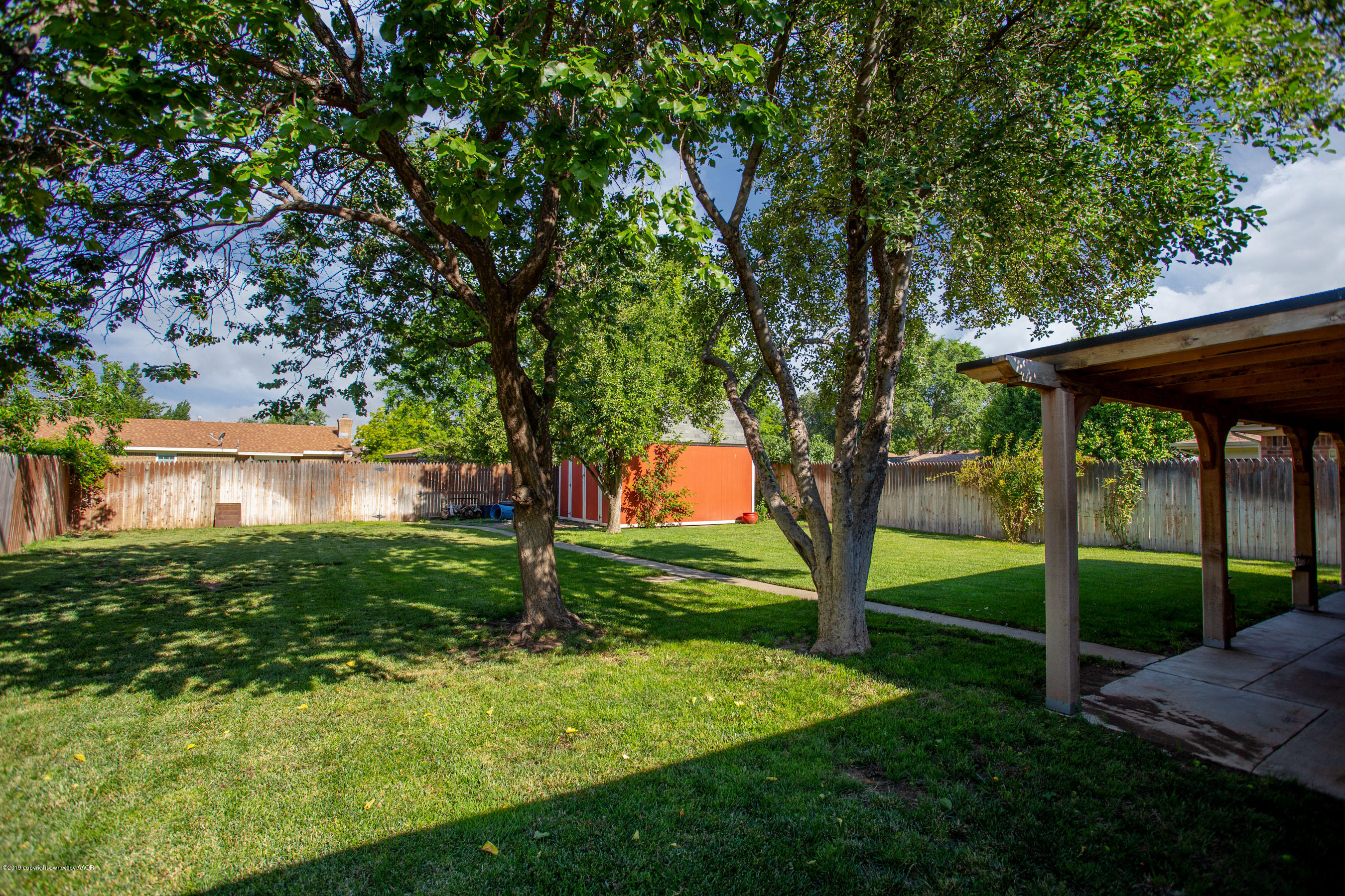 8110 Santa Fe Trail Amarillo, TX 79110 - Photo 25 of 25 a view of backyard with large trees and plants
