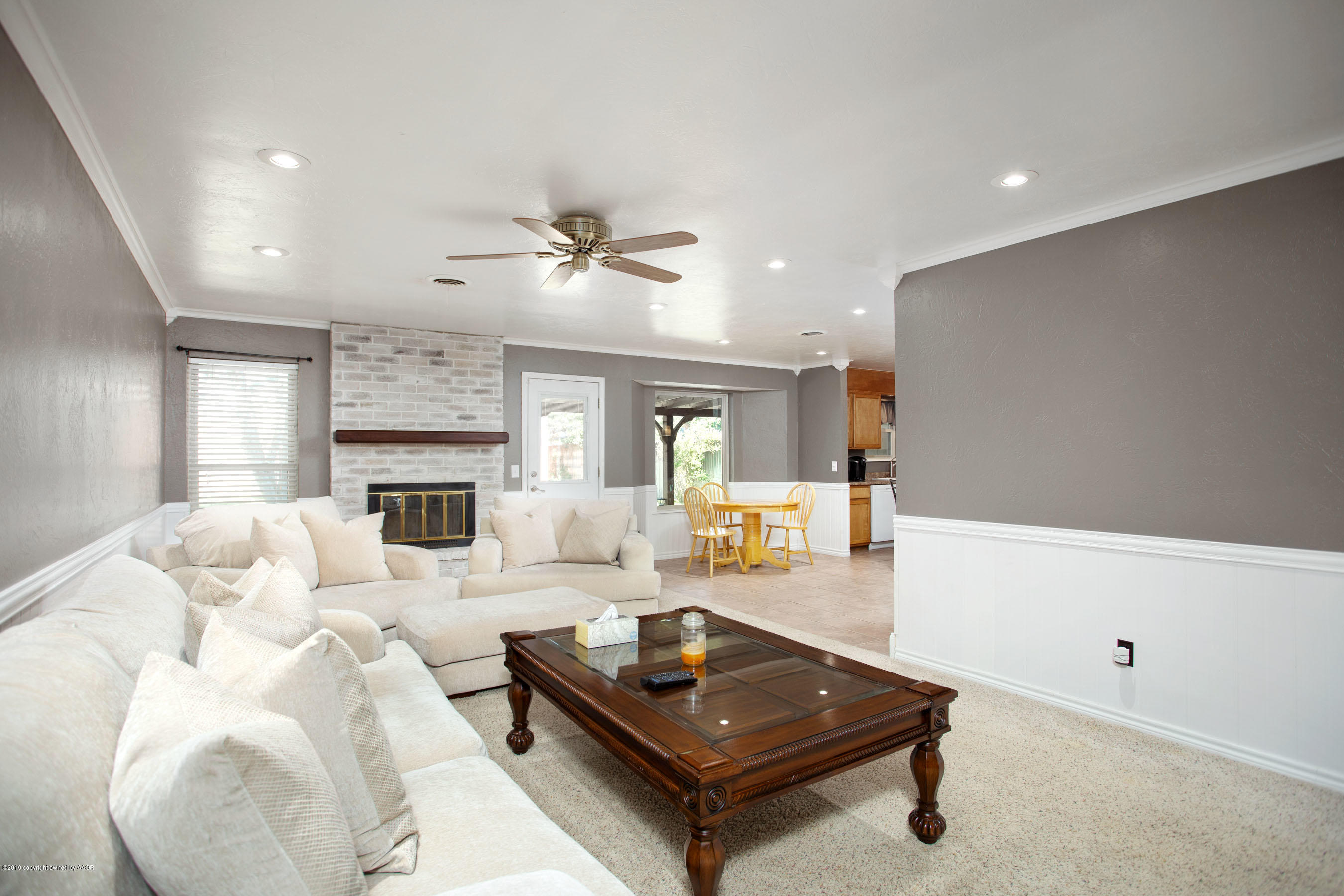 8110 Santa Fe Trail Amarillo, TX 79110 - Photo 4 of 25 a living room with furniture and a fireplace