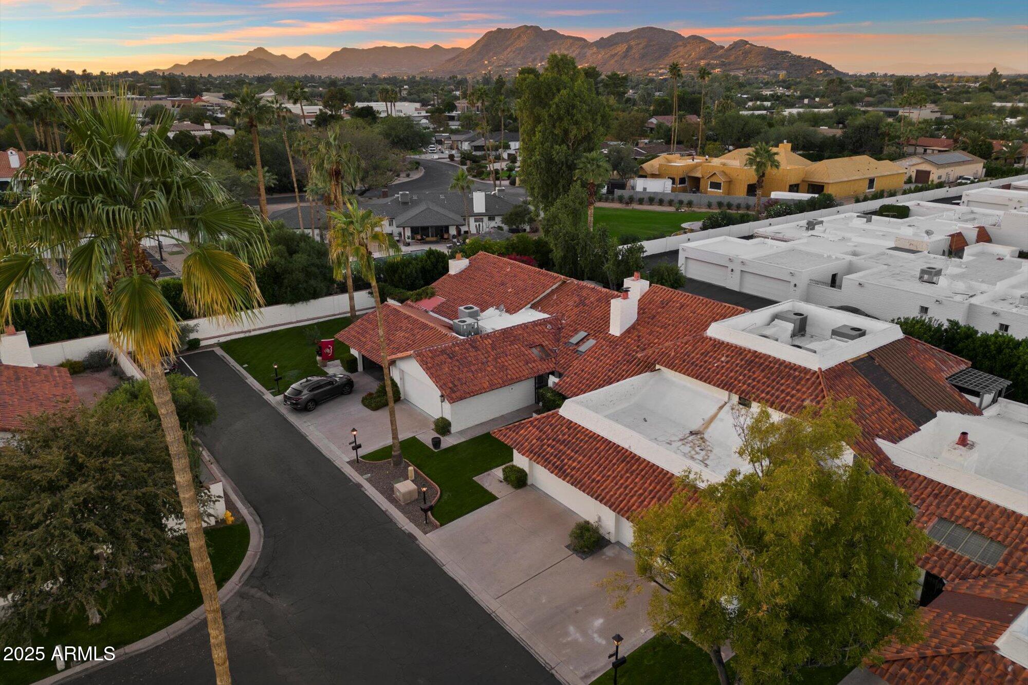 an aerial view of a house with a garden
