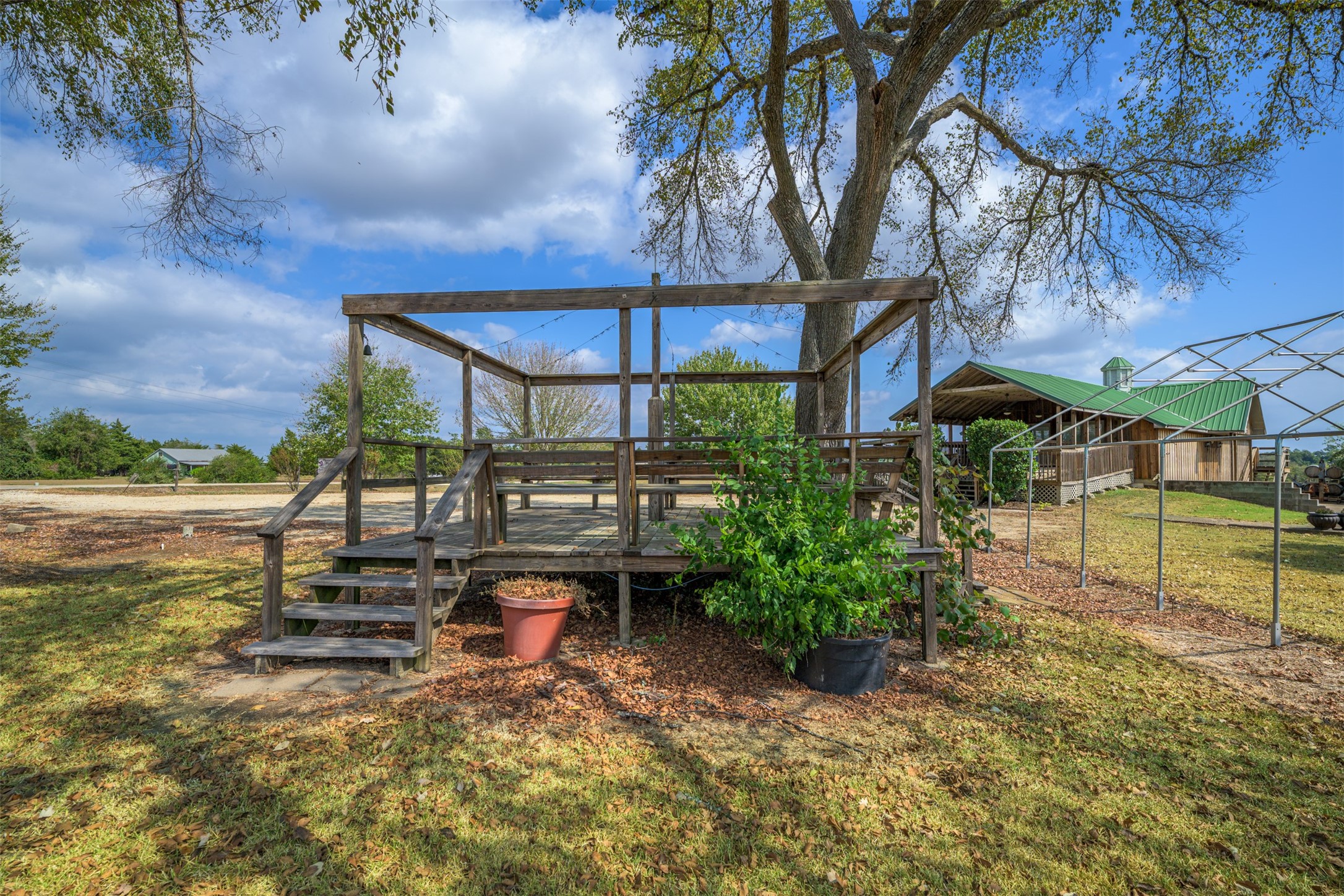 1441 Salem Road Brenham, TX 77833 - Photo 33 of 34 a backyard of a house with barbeque oven table and chairs