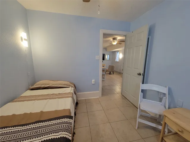 a bathroom with a sink toilet and a mirror