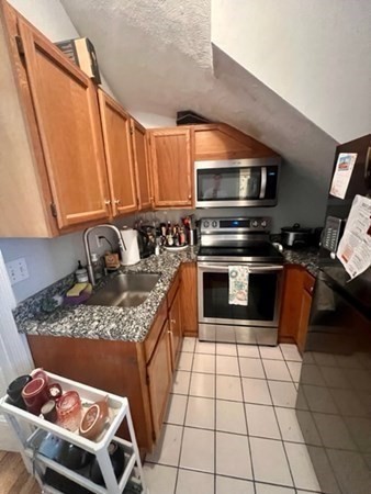 93 East Brookline Street, Unit 2 Boston, MA 02118 - Photo 5 of 8 a kitchen with a stove a sink and a microwave