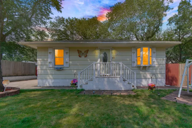 a view of a backyard with a small cabin