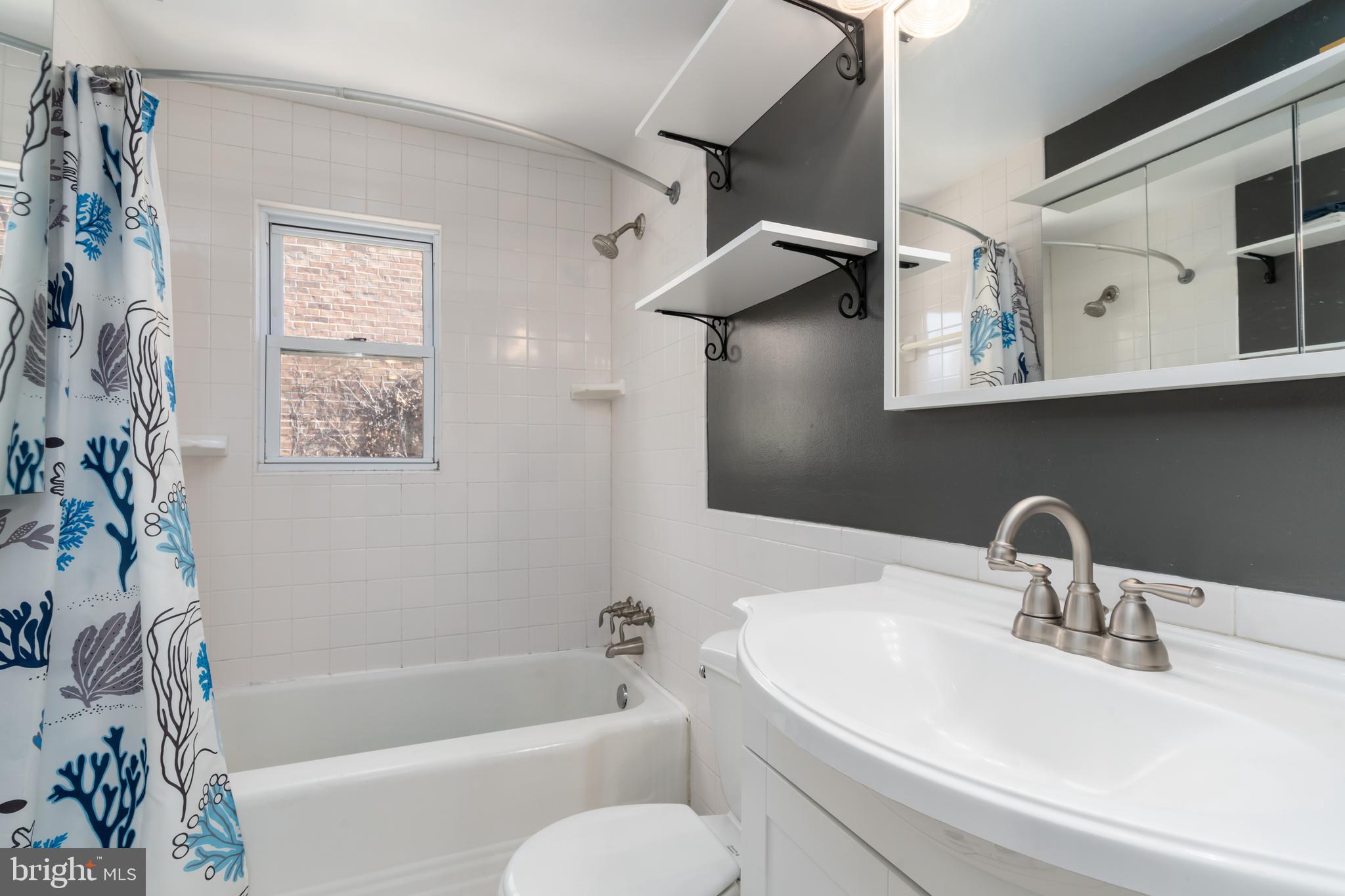 901 Princess Street Alexandria, VA 22314 - Photo 19 of 21 Upstairs Bathroom with Shower/tub combination.