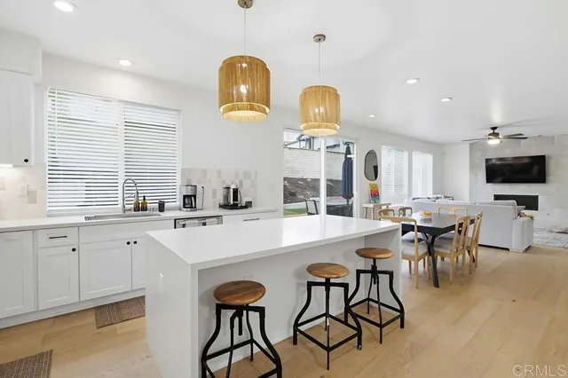 a kitchen with cabinets and stainless steel appliances