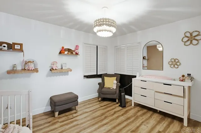 a bathroom with a sink mirror and toilet
