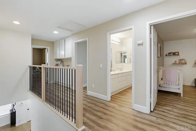 a bedroom with a bed and ceiling fan