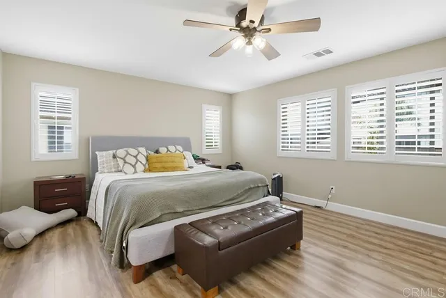 a spacious bathroom with a sink a mirror a bathtub and shower