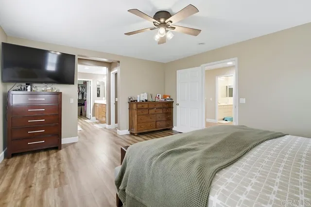 a spacious bathroom with a double vanity sink and a mirror