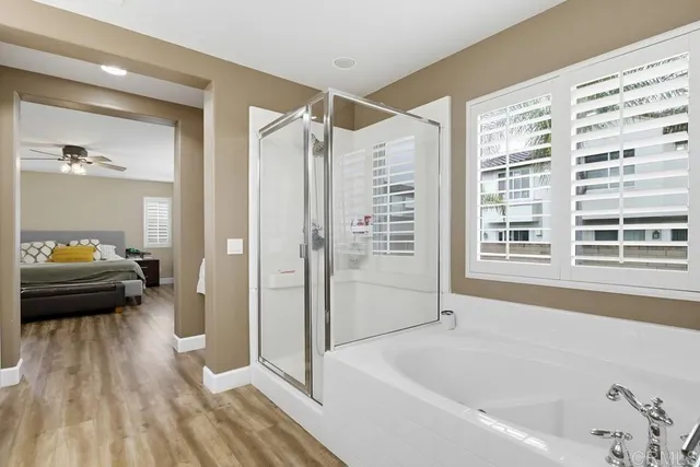 a bedroom with a bed and a table in it