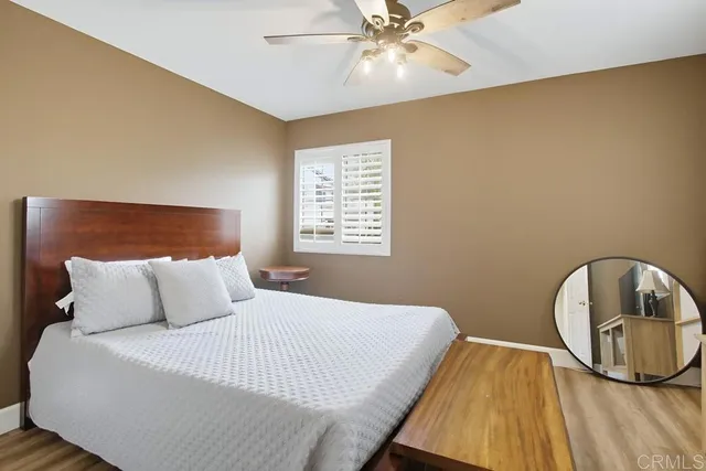 a view of a patio with table and chairs and potted plants