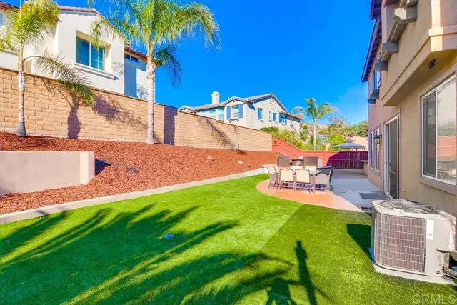 a view of a balcony with flower plants