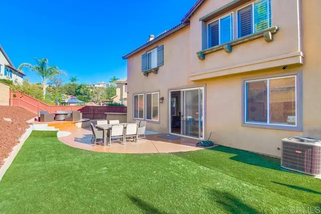 a view of a swimming pool with an outdoor seating and a lake view
