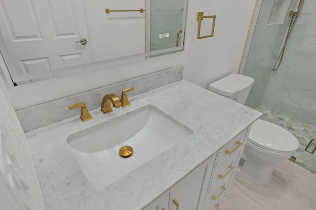 a bathroom with a sink and toilet