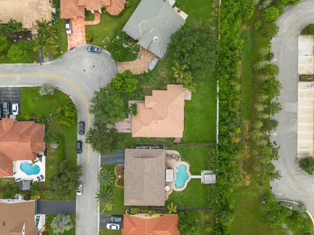 an aerial view of multiple houses with yard
