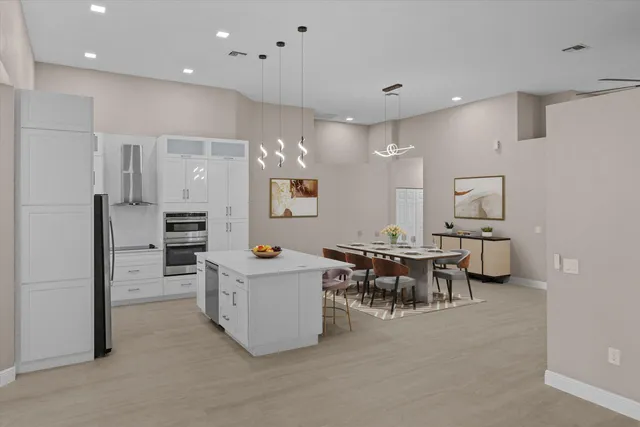 a large kitchen with a table and chairs