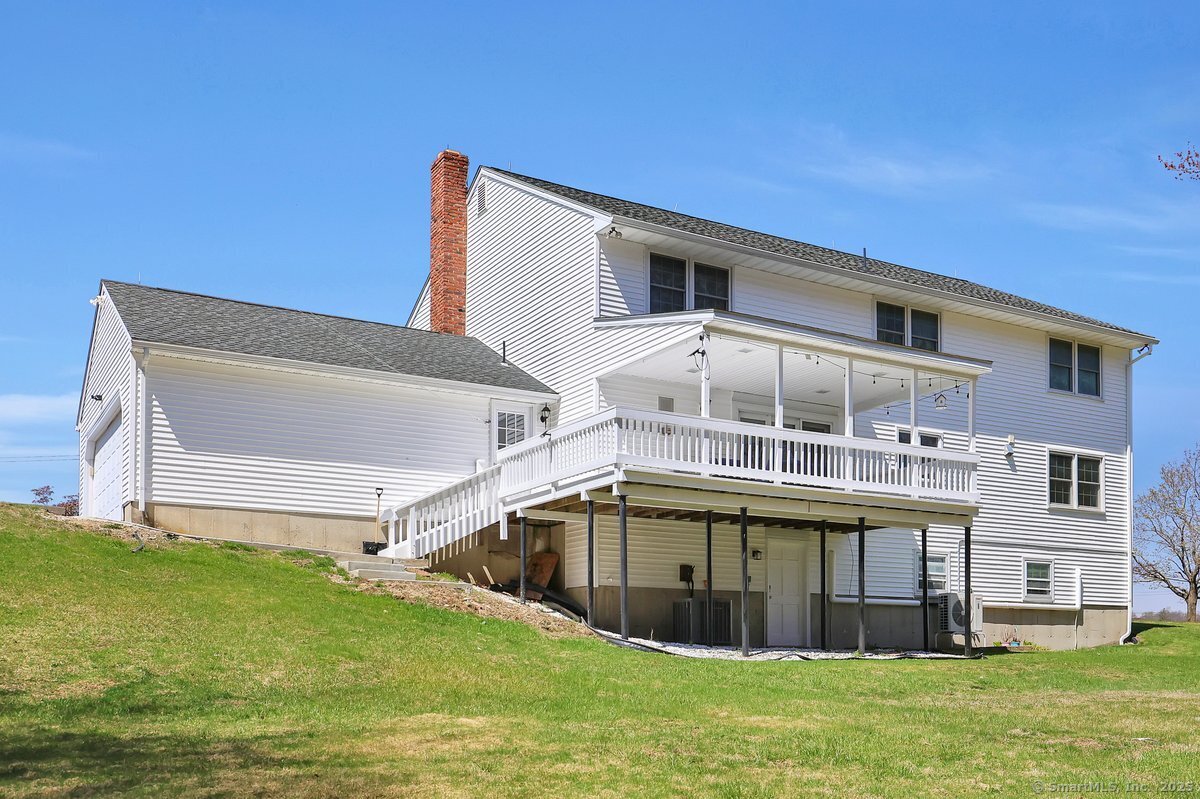 96 Neill Drive Watertown, CT 06795 - Photo 3 of 20 a view of a house with a yard