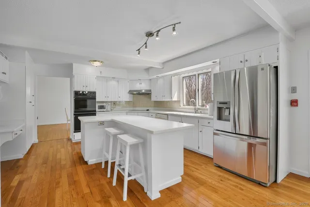 a kitchen with counter top space and stainless steel appliances