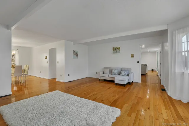 a spacious bedroom with a bed and a table