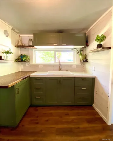 a kitchen with a sink and cabinets