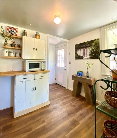 a kitchen with stainless steel appliances a sink stove and cabinets