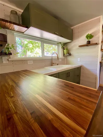 a view of a living room with a large window