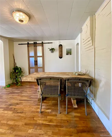 a workspace with furniture window and wooden floor