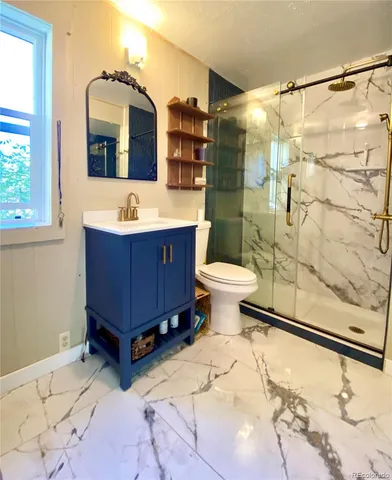 a bathroom with a sink mirror toilet and bathtub