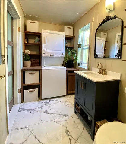 a en suite bathroom with a sink and a mirror