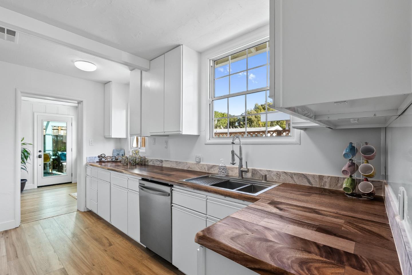 320 Hillcrest Drive Aptos, CA 95003 - Photo 13 of 36 a kitchen with a sink and cabinets