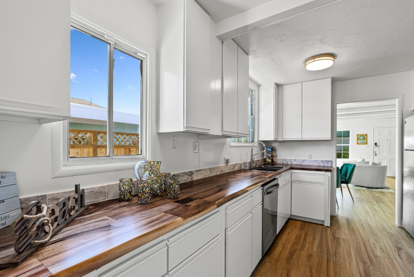 320 Hillcrest Drive Aptos, CA 95003 - Photo 14 of 36 a kitchen with a sink stove and cabinets