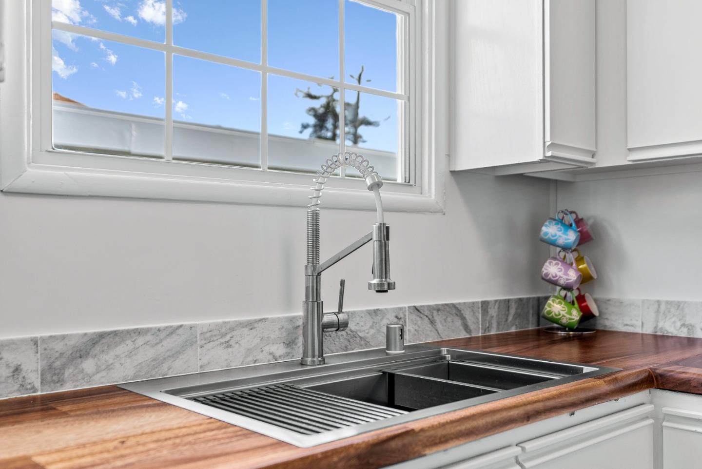 320 Hillcrest Drive Aptos, CA 95003 - Photo 15 of 36 a kitchen with stainless steel appliances a sink cabinets and wooden floor