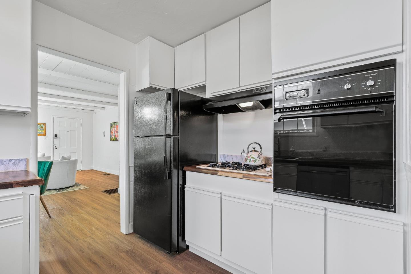 320 Hillcrest Drive Aptos, CA 95003 - Photo 16 of 36 a kitchen with stainless steel appliances and wooden floor