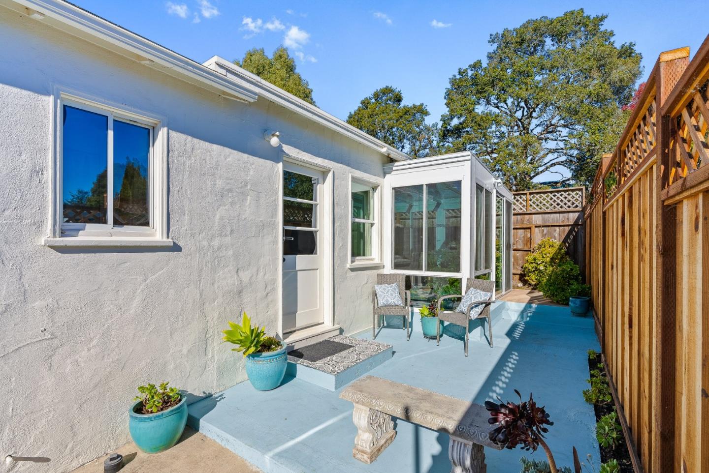 320 Hillcrest Drive Aptos, CA 95003 - Photo 6 of 36 a house with a table and chairs potted plants with wooden floor and a potted plant