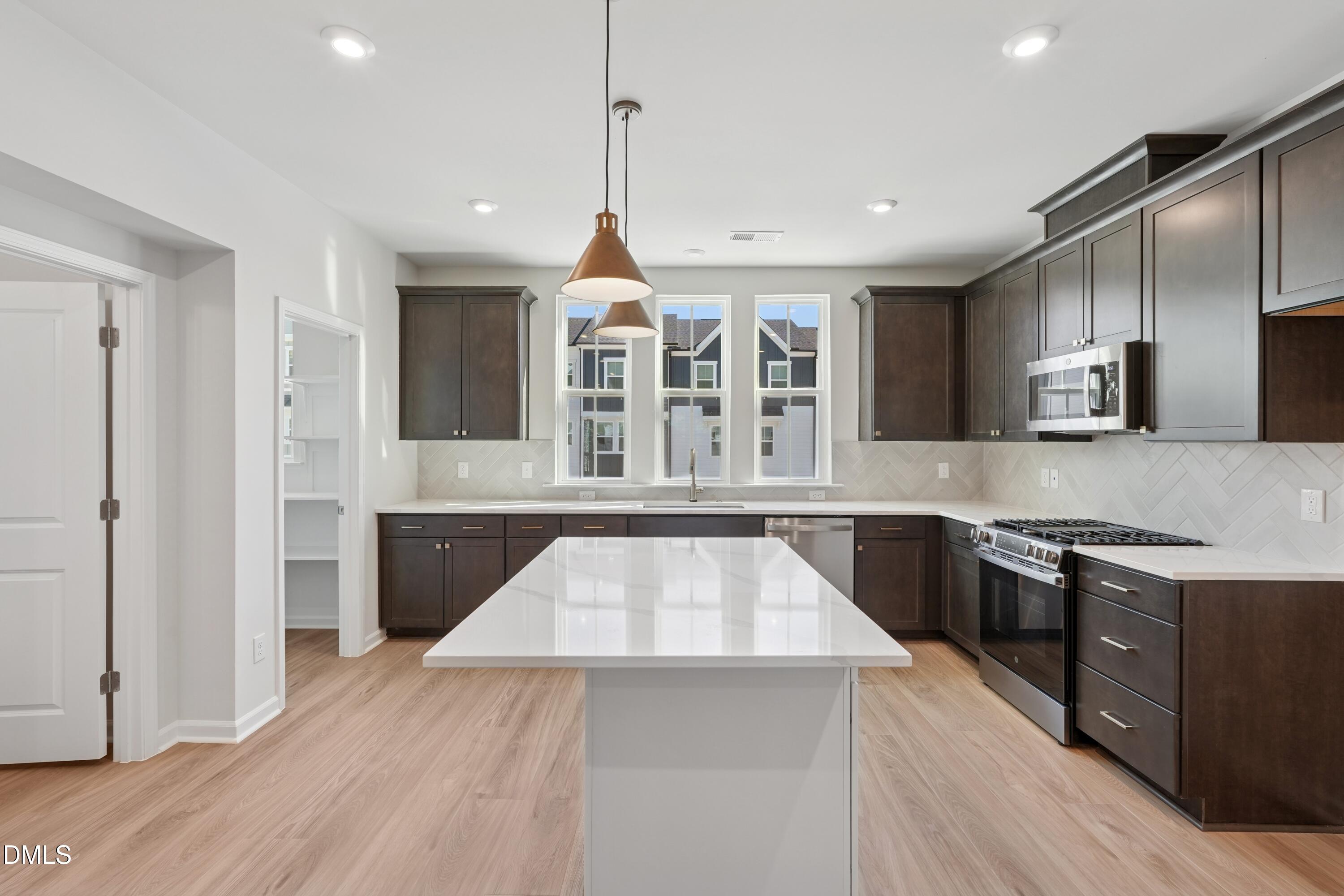 2031 Trident Maple Lane Chapel Hill, NC 27517 - Photo 3 of 31 Twinleaf Townes 88_Kitchen 1_10.23.25_we