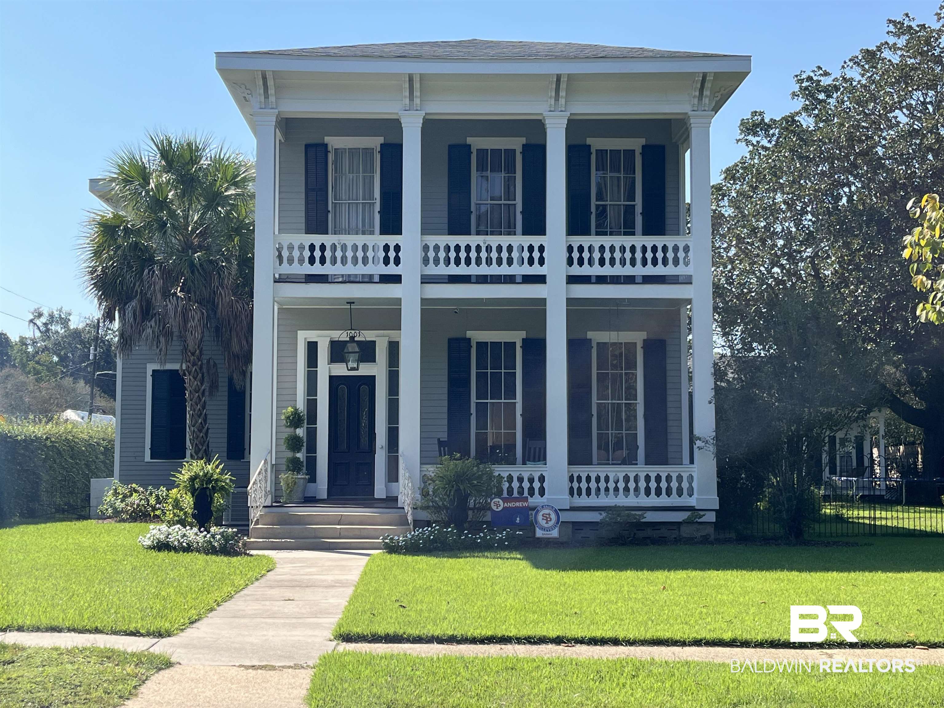 1001 Augusta Street Mobile, AL 36604 - Photo 1 of 26 View of front facade featuring a porch, a front yard, and a balcony
