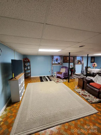 a room with furniture and a flat screen tv