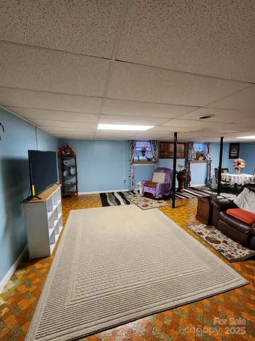 a room with furniture and a flat screen tv