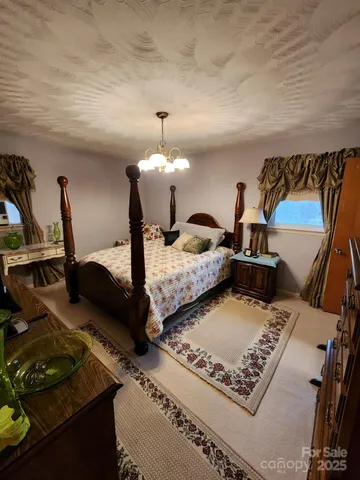 a bed room with two beds and a night stand